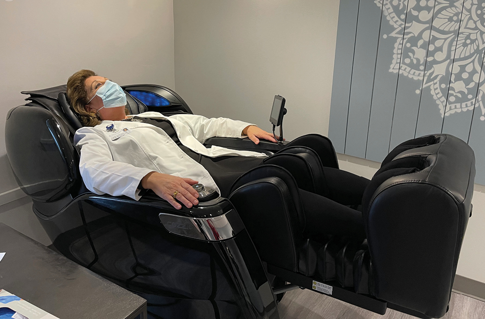 Angela Coladonato, DNP, RN,  NEA-BC, relaxing in Chester County Hospital's Renewal Center massage chair
